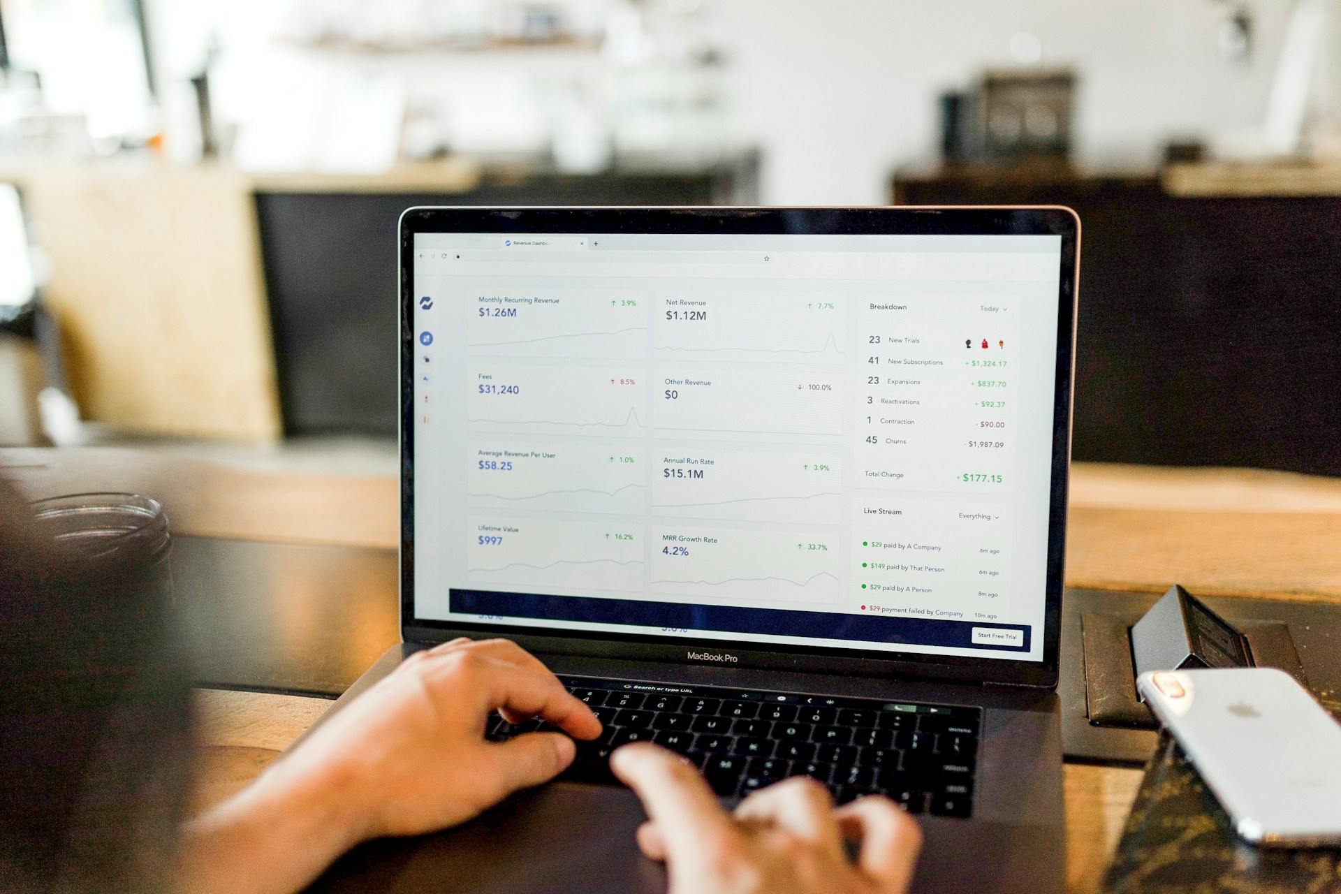 Person looking at laptop with business finances.