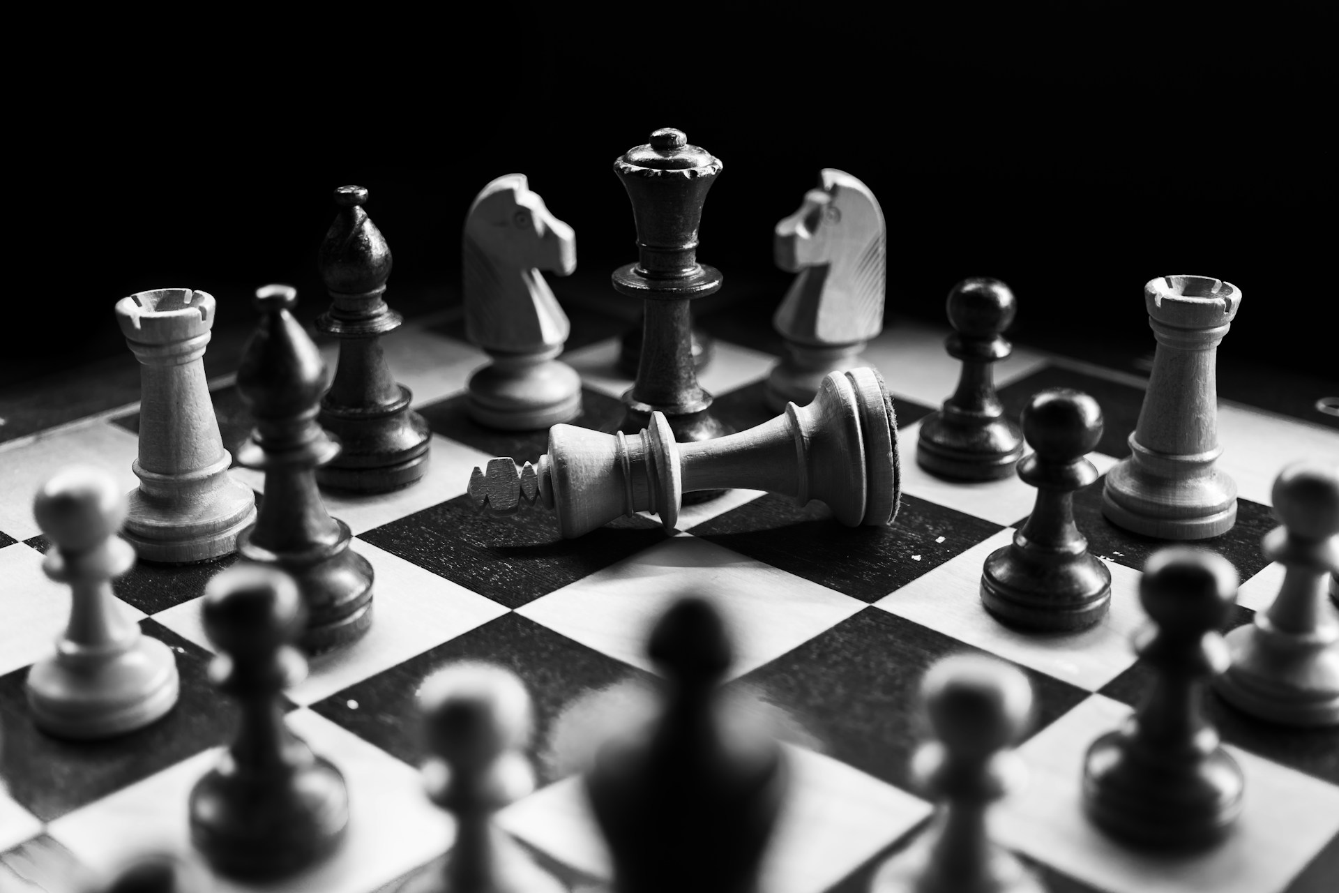 Chess pieces and board demonstrating competition.